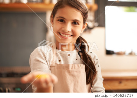 Girl, portrait and dough in hand for baking, pastry and prepare flour mixture in kitchen. Female person, kid and smile for learning in home, child development and education for cookie skill or cake Girl, portrait and dough in hand for baking, pastry and prepare flour mixture in kitchen. Female person, kid and smile for learning in home, child development and education for cookie skill or cake 140628717