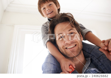 Father with son on his shoulders, portrait and home with smile and love with single parent and bonding together. Family, dad carrying boy and childhood with fun and playing with joy and happiness 140628882