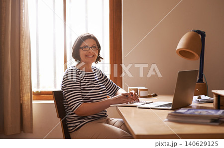 Portrait, businesswoman and positive in home office with confidence, laptop and freelancer with notes for project. Face, entrepreneur and smile for wellness and online research in startup company Portrait, businesswoman and positive in home office with confidence, laptop and freelancer with notes for project. Face, entrepreneur and smile for wellness and online research in startup company 140629125