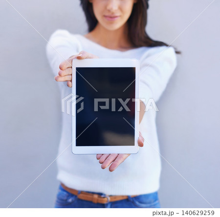 Tablet, show and hands of woman in studio background, smile and happiness for mobile and media. Presentation, female person and girl with digital device, mockup and screen of technology and internet 140629259