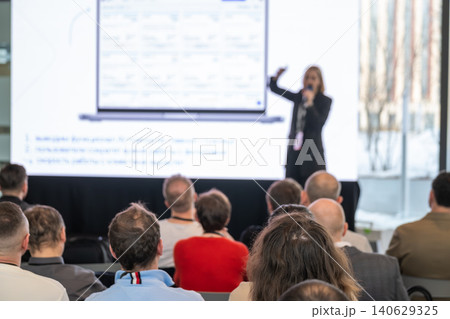 Business presentation with speaker addressing attentive audience at conference and corporate meeting 140629325
