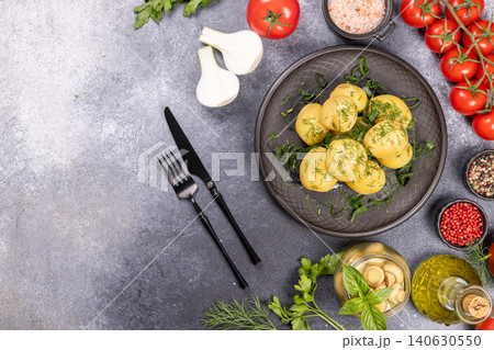 Boiled young potatoes with dill and fresh vegetables flat lay 140630550