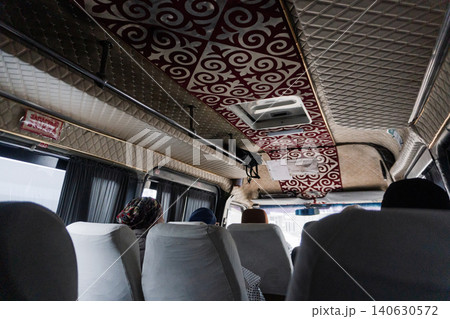 Interior of a public minibus with passengers and traditional ornamental ceiling Interior of a public minibus with passengers and traditional ornamental ceiling 140630572