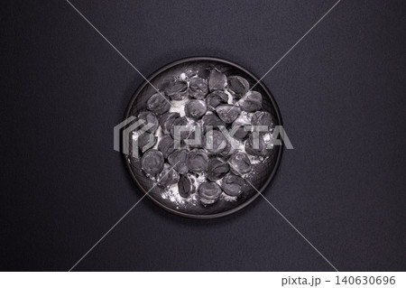 Black pelmeni dumplings with squid ink on plate Black pelmeni dumplings with squid ink on plate 140630696