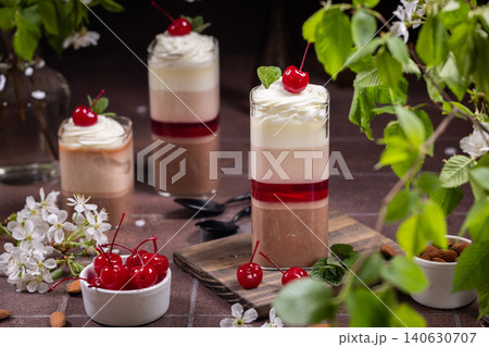Layered chocolate cherry dessert parfait with whipped cream Layered chocolate cherry dessert parfait with whipped cream 140630707
