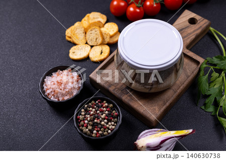 Pickled herring in a jar with various seasonings 140630738