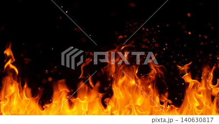 Burning orange flames with glowing embers isolated on black background. Realistic fire effect suitable for visual effects, compositing, motion graphics and video editing. 140630817