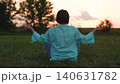 Young woman do yoga sitting green lawn, man meditating sunset, relaxing outdoors, girl relaxing sunset, yoga meditation, body relaxation technique, spiritual self care, rural summer sunset, stress 140631782
