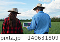 Agriculture and technology fusion, Two generations in farming, Modern farming attire, Professional farm management, Innovative countryside, Tablet-driven farm solutions, Sustainable rural development 140631809