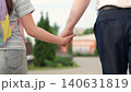 hold textbook hand, happy family, kid child carries school textbook hand, man father leads student backpack by hand, first-graders school backpacks walk with dad park, child with school backpacks 140631819
