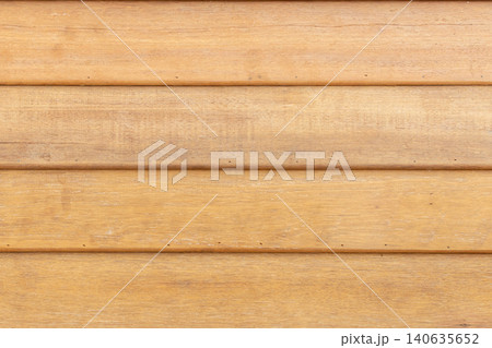 Natural wooden plank surface visible grain warm tones creating clean rustic texture background for design construction interior decoration Natural wooden plank surface visible grain warm tones creating clean rustic texture background for design construction interior decoration 140635652