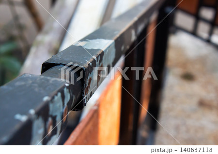 Close Up of Weathered Metal Railing with Peeling Paint and Selective Focus 140637118