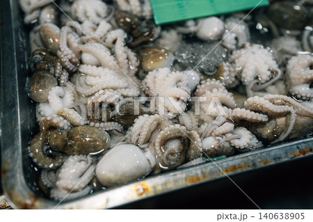 Fresh raw fish displayed on ice for sale at a local seafood market Fresh raw fish displayed on ice for sale at a local seafood market 140638905