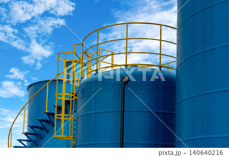 Closeup fuel storage tank in petroleum refinery. Blue big tank of oil storage. Fuel silo. Liquid petroleum tank. Petroleum oil industrial. Fuel station. Oil refinery plant. Petrochemical industry. 140640216