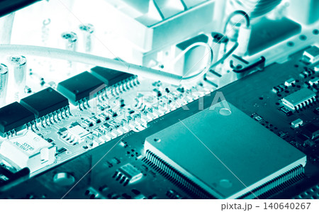 Electronic circuit board. Semiconductor motherboard circuit board technology. Mainboard of computer. Integrated semiconductor microchip on green circuit board. Hi-tech industry and computer science. Electronic circuit board. Semiconductor motherboard circuit board technology. Mainboard of computer. Integrated semiconductor microchip on green circuit board. Hi-tech industry and computer science. 140640267