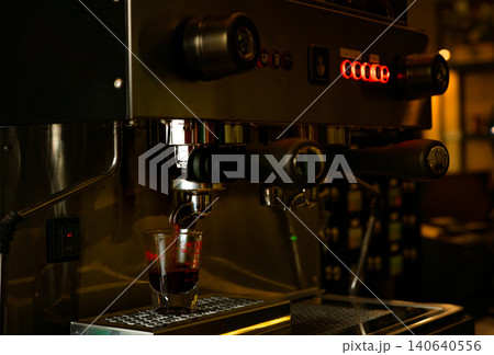 Closeup professional coffee machine in coffee shop. Coffee maker for make espresso, americano, latte, and cappuccino. Counter bar of coffee shop. Modern tool for barista. Beverage service business. 140640556