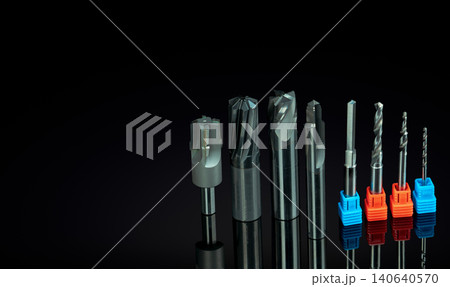 Special tools isolated on black background. Made to order special tools. Coated step drill and reamer detail. HSS cemented carbide. Carbide cutting tool for industrial applications. Engineering tools. 140640570