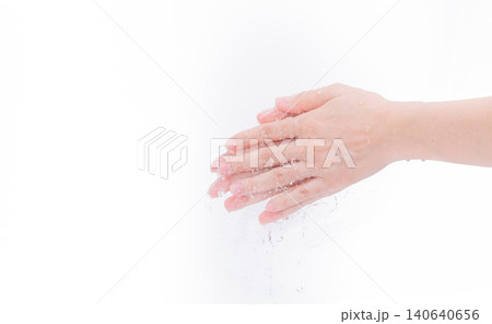 Woman washing hand with water isolated on white background. Good personal hygiene concept. First step to clean dirty hands for prevent flu and coronavirus. Adult woman hand soak and wet with water. Woman washing hand with water isolated on white background. Good personal hygiene concept. First step to clean dirty hands for prevent flu and coronavirus. Adult woman hand soak and wet with water. 140640656