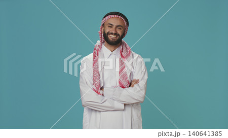 In the studio, Islamic person says yes and nods, indicating support and acceptance for things, Middle Eastern guy expressing his opinion in studio, showcasing optimism and positivity. In the studio, Islamic person says yes and nods, indicating support and acceptance for things, Middle Eastern guy expressing his opinion in studio, showcasing optimism and positivity. 140641385