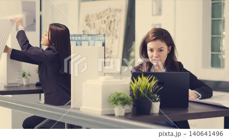POV of designer interacting with client via video call connection to review architectural plan proposals and suggest renovation choices. POV of designer interacting with client via video call connection to review architectural plan proposals and suggest renovation choices. 140641496
