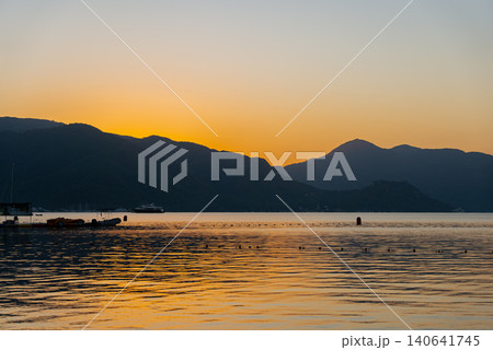Marmaris Waterfront at Golden Hour with Sea Mountains and Boat 140641745