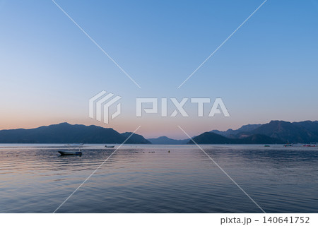 Marmaris Waterfront at Blue Hour with Sea Mountains and Boat Marmaris Waterfront at Blue Hour with Sea Mountains and Boat 140641752