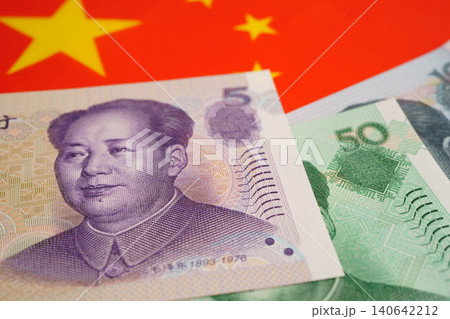 China yuan banknote money with flag, investment economy business and banking. China yuan banknote money with flag, investment economy business and banking. 140642212