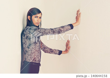 Confident, portrait and woman in studio fashion, trendy or serious female person in stylish or creative comfort. Casual, printed and designer jacket, isolated on white background or makeup or glamour Confident, portrait and woman in studio fashion, trendy or serious female person in stylish or creative comfort. Casual, printed and designer jacket, isolated on white background or makeup or glamour 140644158