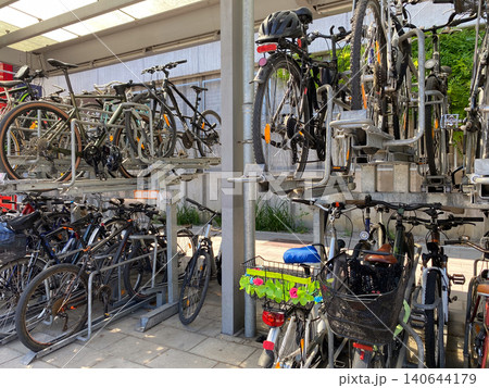 Two-tier bike storage system in a European city, eco-friendly transport concept. 140644179