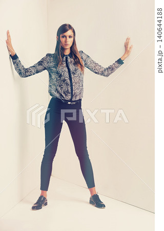 Cool, portrait and woman in studio fashion, trendy and serious female person in stylish and creative comfort. Casual, printed and designer jacket, isolated on white background with makeup or glamour 140644188