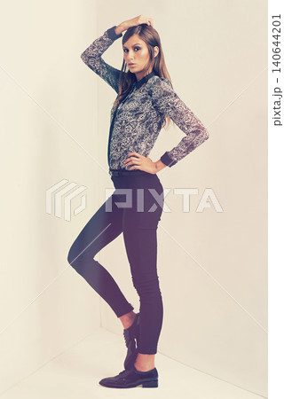 Vintage, fashion and portrait of woman for clothes, beauty and trendy with retro outfit isolated in studio background. Female person, model and lady with print shirt, formal trousers and shoes 140644201