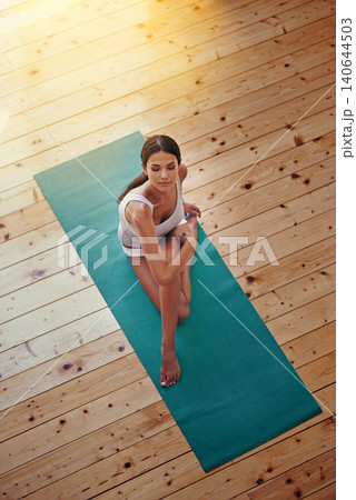Yoga, wellness and woman in gym for exercise with zen, balance or health workout. Mindfulness, calm and high angle of female person with pilates training for fitness with mat on floor in studio. Yoga, wellness and woman in gym for exercise with zen, balance or health workout. Mindfulness, calm and high angle of female person with pilates training for fitness with mat on floor in studio. 140644503