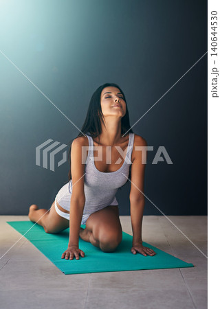 Yoga mat, wellness and calm woman stretching in apartment for zen, health and fitness exercise. Meditation, mockup and young female person with pilates workout for body movement on floor at home. Yoga mat, wellness and calm woman stretching in apartment for zen, health and fitness exercise. Meditation, mockup and young female person with pilates workout for body movement on floor at home. 140644530