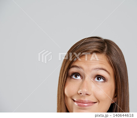 Studio, head and closeup with smile, thinking and mockup for idea or vision. Woman, planning and happy with optimism, positive and hopeful for future contemplating isolated on white background Studio, head and closeup with smile, thinking and mockup for idea or vision. Woman, planning and happy with optimism, positive and hopeful for future contemplating isolated on white background 140644618
