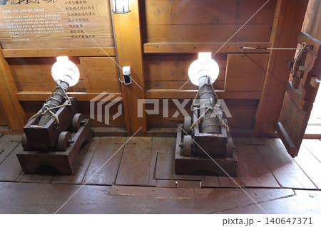Historic Cannons in Wooden Museum Display Historic Cannons in Wooden Museum Display 140647371