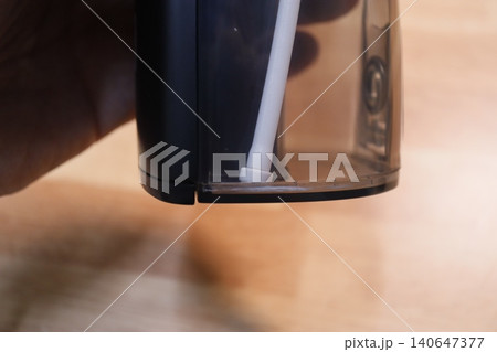 Close-up of Hand Holding Electronic Device Component Close-up of Hand Holding Electronic Device Component 140647377