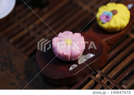 Delicate Flower-Shaped Pastries on Wooden Trays Delicate Flower-Shaped Pastries on Wooden Trays 140647478