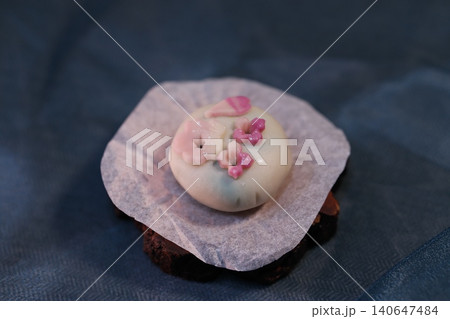 Delicate Japanese Wagashi Sweet with Pink Floral Decorations Delicate Japanese Wagashi Sweet with Pink Floral Decorations 140647484
