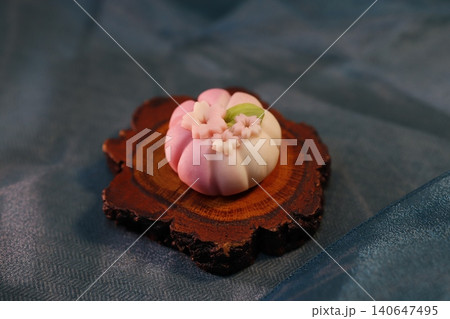 Delicate Pink and White Wagashi on Wooden Slice 140647495
