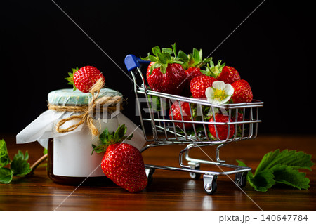 homemade strawberry jam jar with fresh berries on wooden table homemade strawberry jam jar with fresh berries on wooden table 140647784