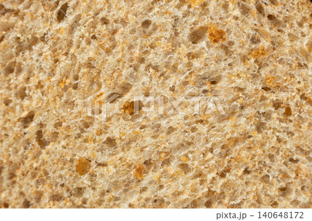 Macro texture of whole wheat bread crumb, detailed food background. Macro texture of whole wheat bread crumb, detailed food background. 140648172
