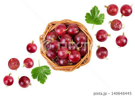 Red gooseberry in a wicker basket isolated on white background. Top view. Flat lay. Red gooseberry in a wicker basket isolated on white background. Top view. Flat lay. 140648445