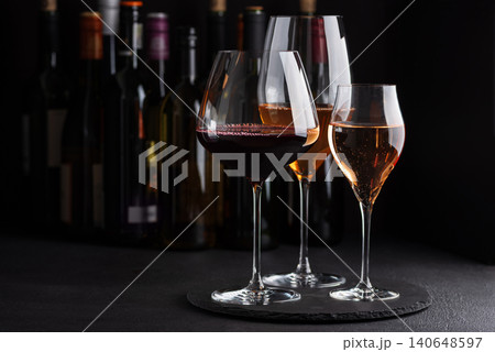 Wine glasses with red, white, and rose wine tasting Wine glasses with red, white, and rose wine tasting 140648597
