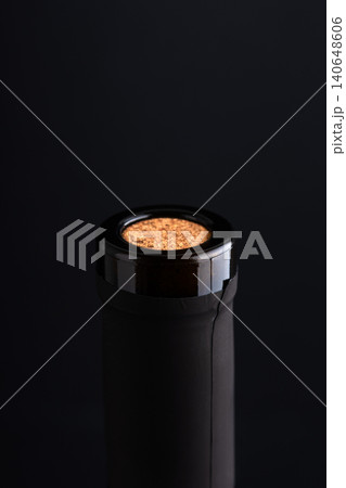 Wine bottle neck with cork on black background Wine bottle neck with cork on black background 140648606