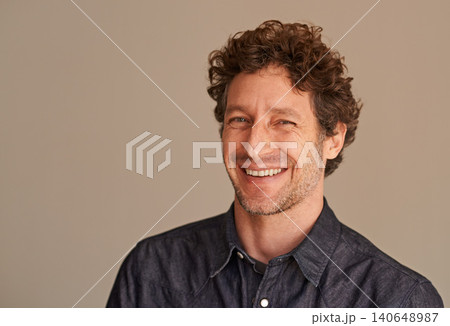 Mature man, portrait and laugh in studio, comedy and funny memory to remember on brown background. Happy male person, positive and comic for silly or goofy joke, smile and humor on mockup space Mature man, portrait and laugh in studio, comedy and funny memory to remember on brown background. Happy male person, positive and comic for silly or goofy joke, smile and humor on mockup space 140648987