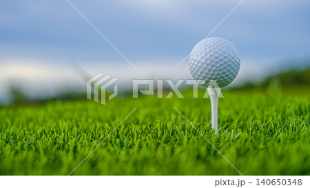 Golf ball on green grass in the evening golf course with sunshine background. 140650348
