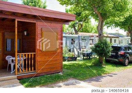 Wooden Holiday Bungalow With Veranda and Cars at Mixed Campsite 140650416
