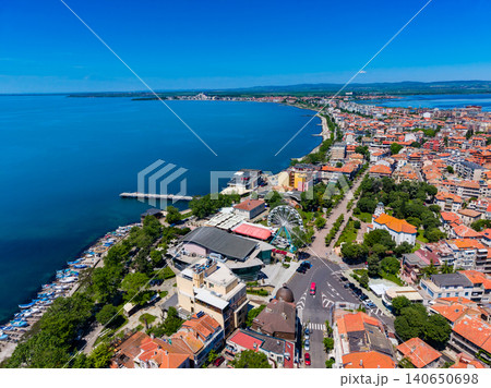 Seaside town with vibrant scene. Scenic aerial shot of marina and colorful rooftops. Drone captures charming seaside village with bustling market and tranquil bay setting 140650698