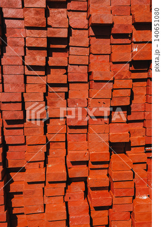 Stacked red bricks at a construction site in daylight showing building materials ready for use in various projects Stacked red bricks at a construction site in daylight showing building materials ready for use in various projects 140651080