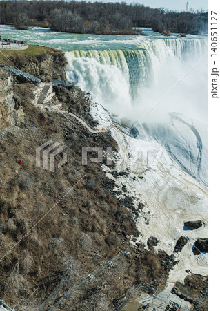 Niagara Falls viewed from above showing water flow over rocks in an outdoor setting during daylight Niagara Falls viewed from above showing water flow over rocks in an outdoor setting during daylight 140651127